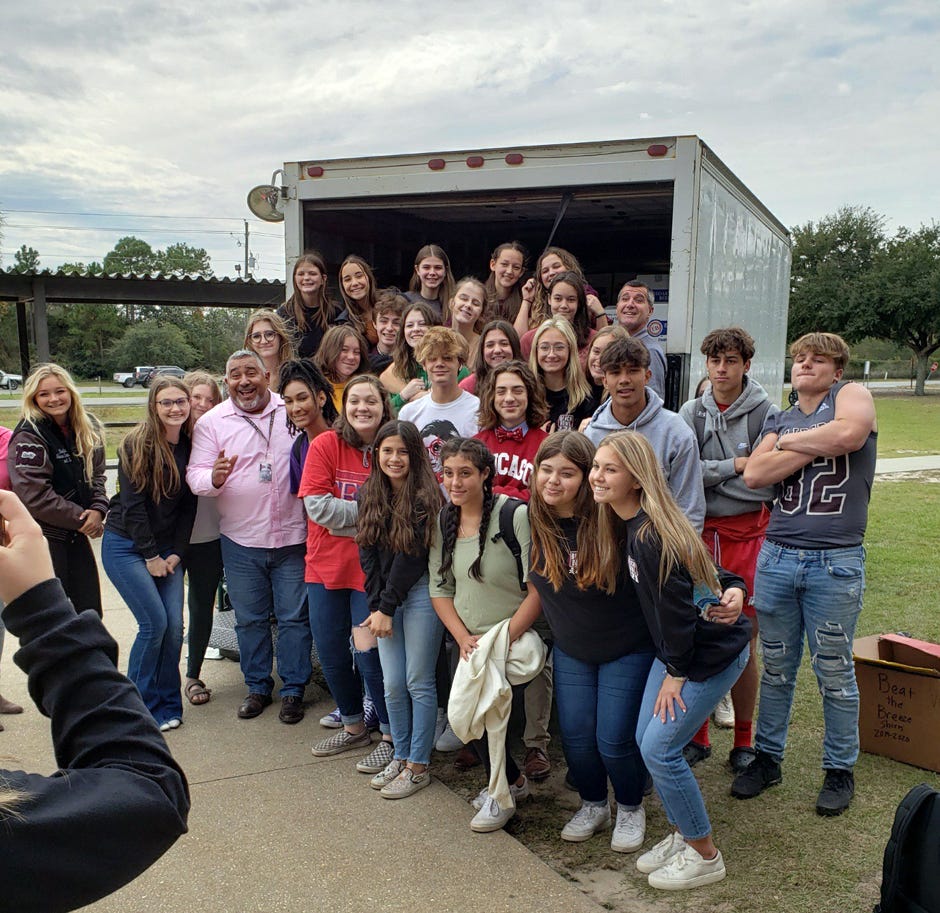Navarre High School students collected a total of 7,641 items in a food drive competition against Gulf Breeze High School. Their participation in the Caring and Sharing Beach Soup Bowl competition will help Santa Rosa County families with their food needs through the Thanksgiving holiday.