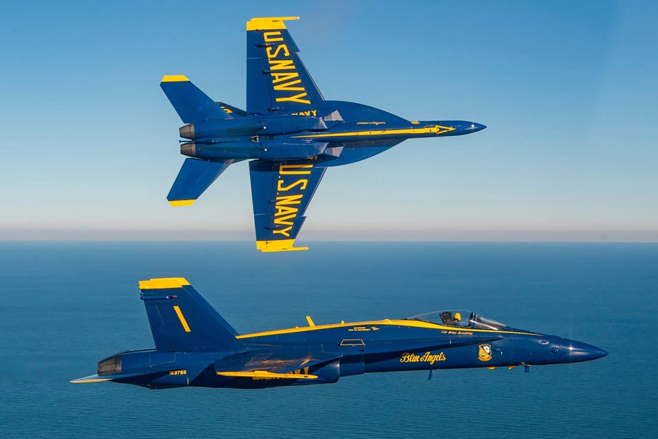A Super Hornet and Legacy Hornet perform during a 2021 air show.