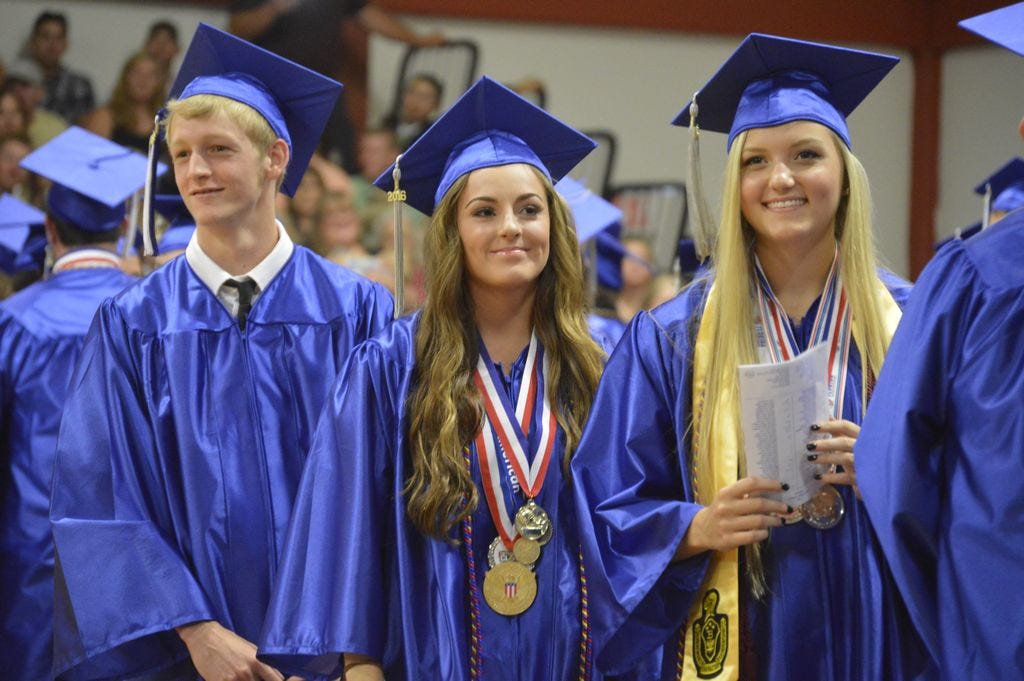 Graduates with the Jay High School class of 2016 look out in to the crowd for friends and family members during their commencement Tuesday evening.
