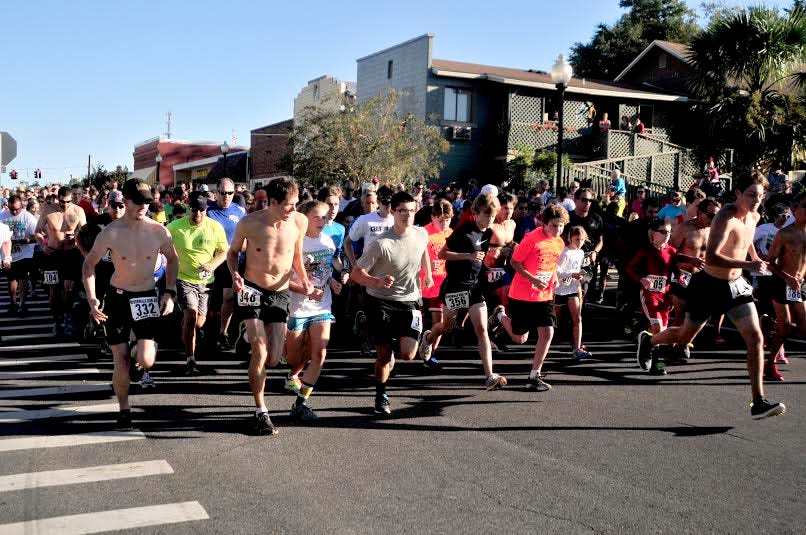 Participants in a previous Riverwalk Run 5K take off from the starting line on Willing Street in downtown Milton.