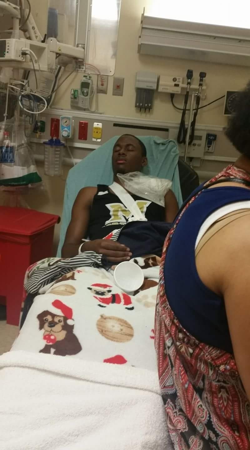 Deionte Ganzy lies in a hospital bed after breaking his collarbone at a Feb. 25 track meet. [Special to the Press Gazette]