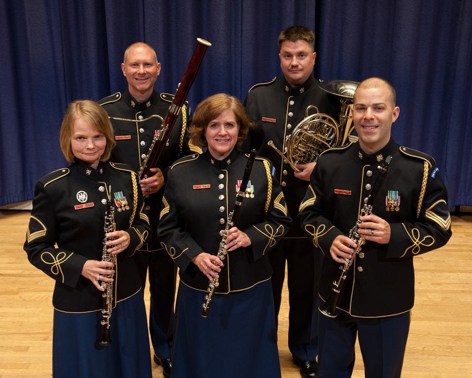 The U.S. Army Woodwind Quintet performs a free concert at PSC May 26. Shown front row from left: MSG Barbara Vigil, flute; SSG Meredeth Rouse, oboe; and SSG Aaron Scott, clarinet; back row from left: MSG Max Wharton, bassoon; and SSG Aaron Cockson, French horn.