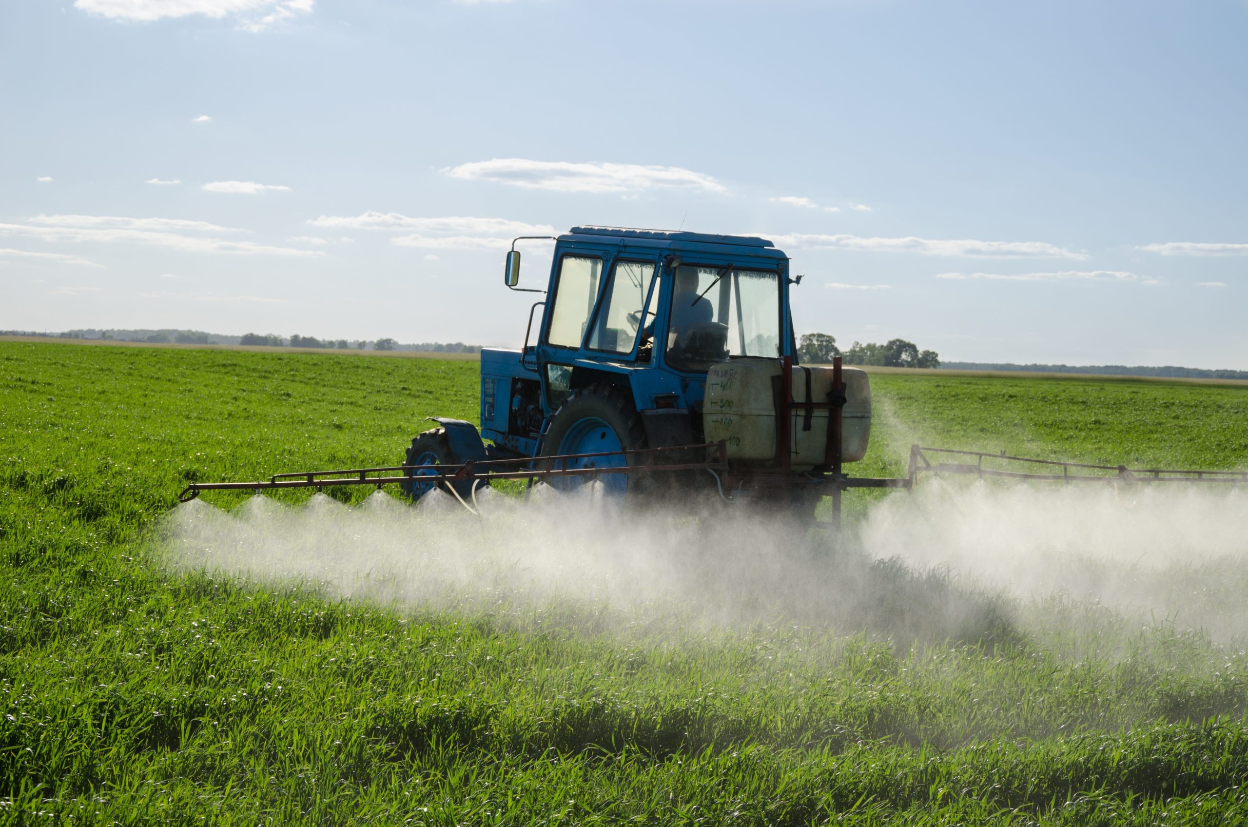 A tractor sprays fertilizer in a field. [Special to the Press Gazette]