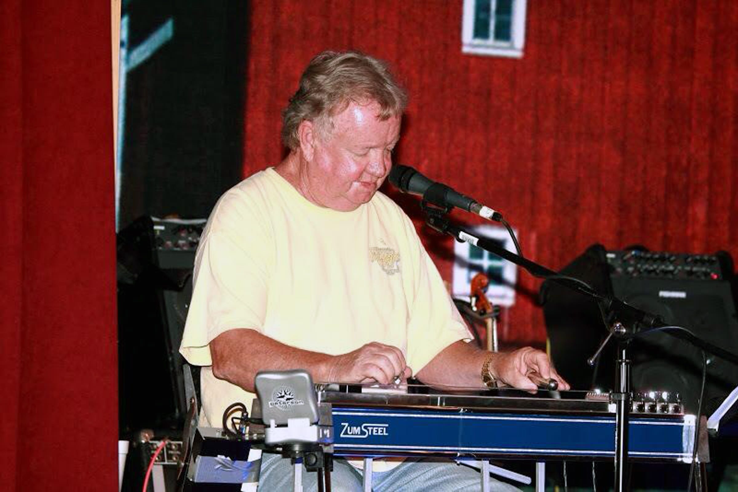 Sandy Wyatt plays his steel guitar with the Saw Mill Band at the Farmer's Opry House. [CONTRIBUTED PHOTO]