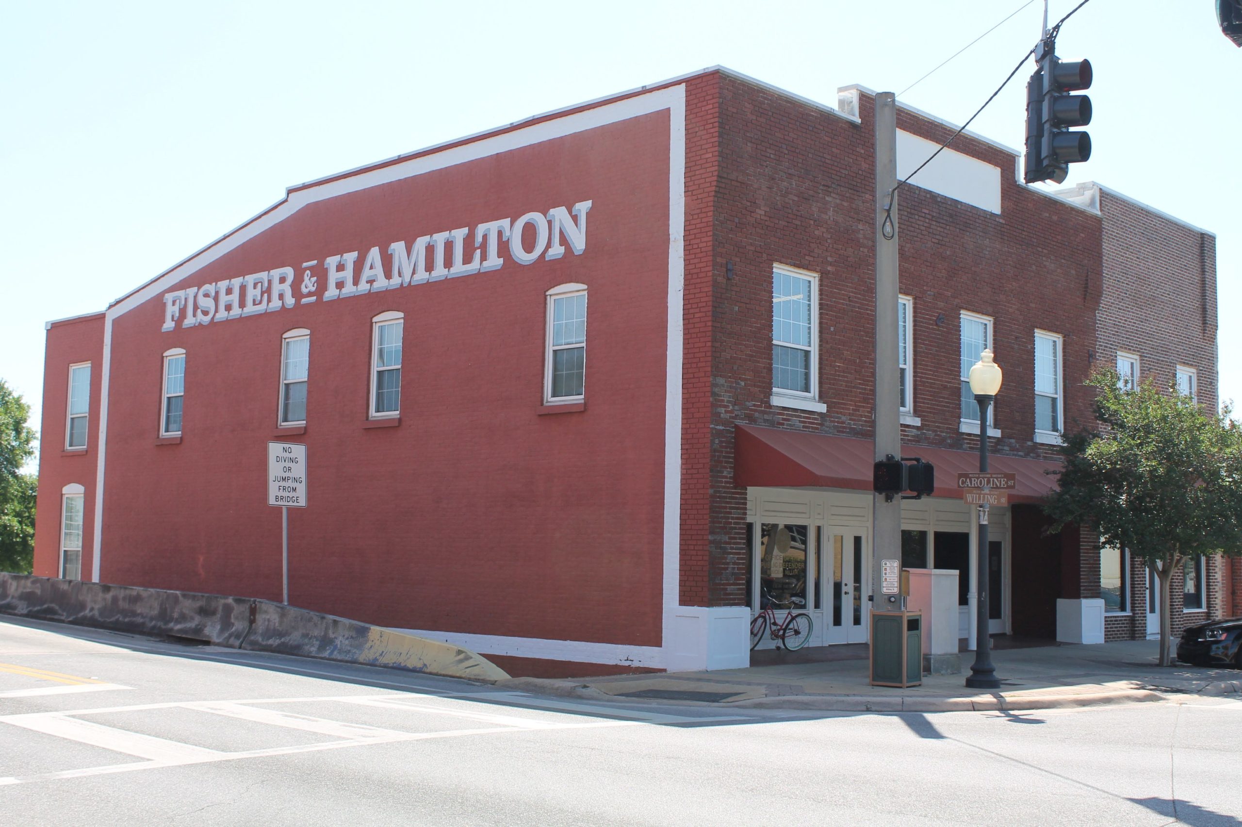 The Fisher Hamilton building at the corner of Willing Street and Highway 90 in downtown Milton is a hot topic within the discussions of the Board of County Commissioners about the courthouse decision and the possible widening of Highway 90.