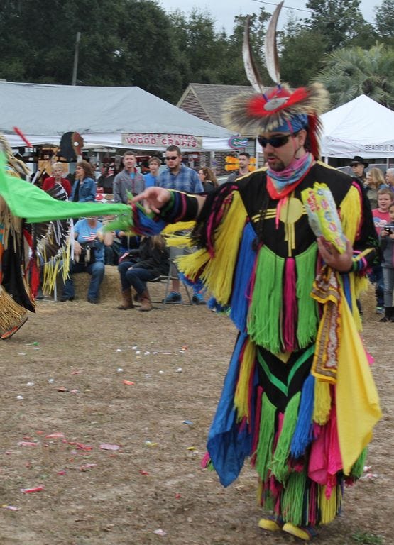 A Creek Indian member dances at a pow wow. This year’s event will be November 21 and 22 at Floridatown Park, the last one at the park before moving to the tribe’s own land by next year.