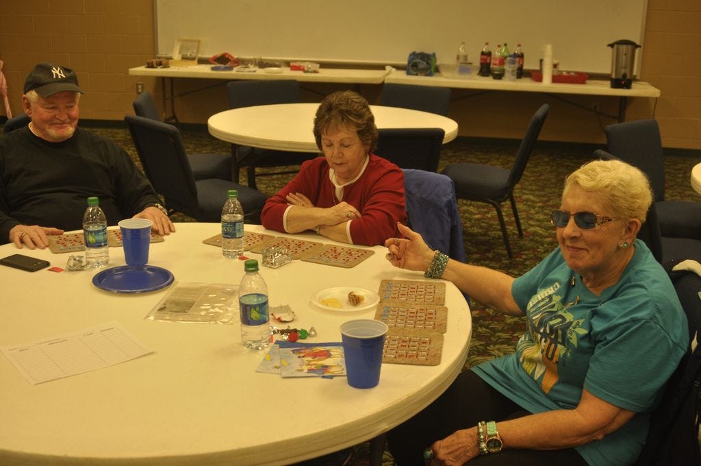 Suzanna Jones, right, joins fellow area senior citizens for a game of bingo at the Guy Thompson Community Center in Milton.