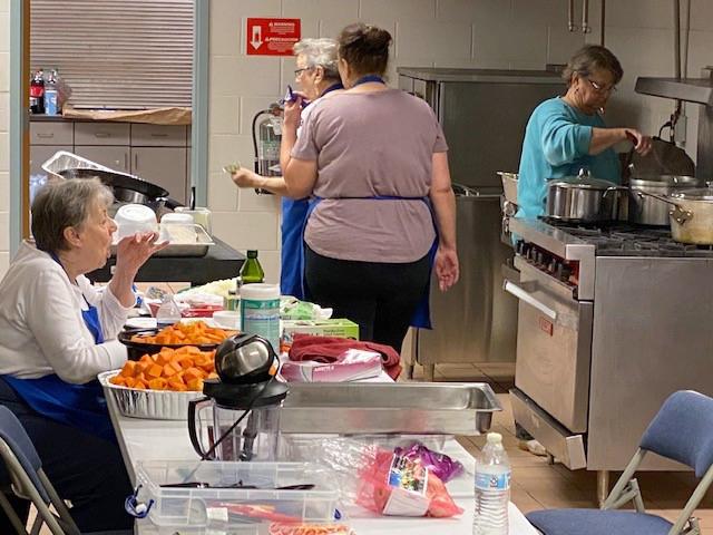 An army of volunteers worked to serve 100 seniors a meal on Christmas Day at the Milton Community Center. [CONTRIBUTED PHOTO]